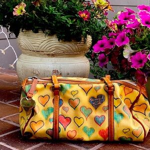 Dooney & Bourke medium handbag with handles. Adorable and very chic!